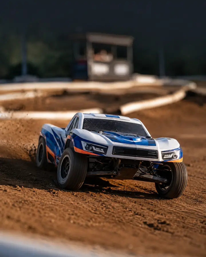RC race buggy on a prepared dirt track
